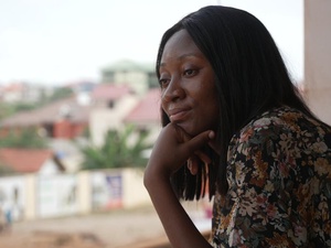 Ghana. Louange Koffi, a refugee nurse at a clinic she volunteers in Accra
