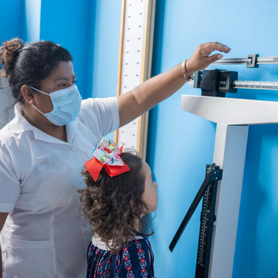 Guatemala. A refugee girl is cared for by health personnel in new and improved facilities.