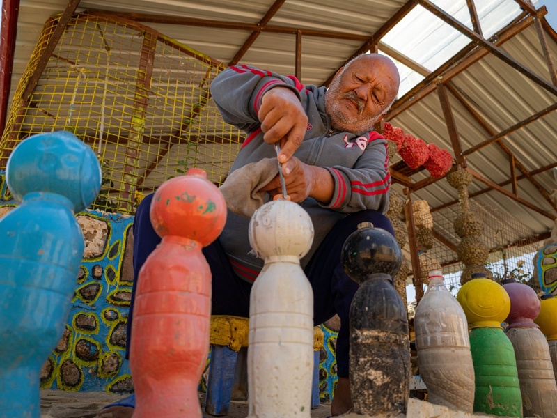 Abu Jihad working on bollards made from plastic bottles. 