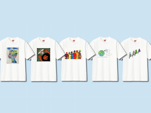 Cinco camisetas blancas con diseños artísticos únicos: una con una persona pintada con acuarela; otra que representa a una persona con una paloma; una tercera que muestra a un grupo de seis personas; una cuarta que muestra la Tierra con un avión de papel; y la quinta tiene un diseño de cuatro pájaros en línea diagonal