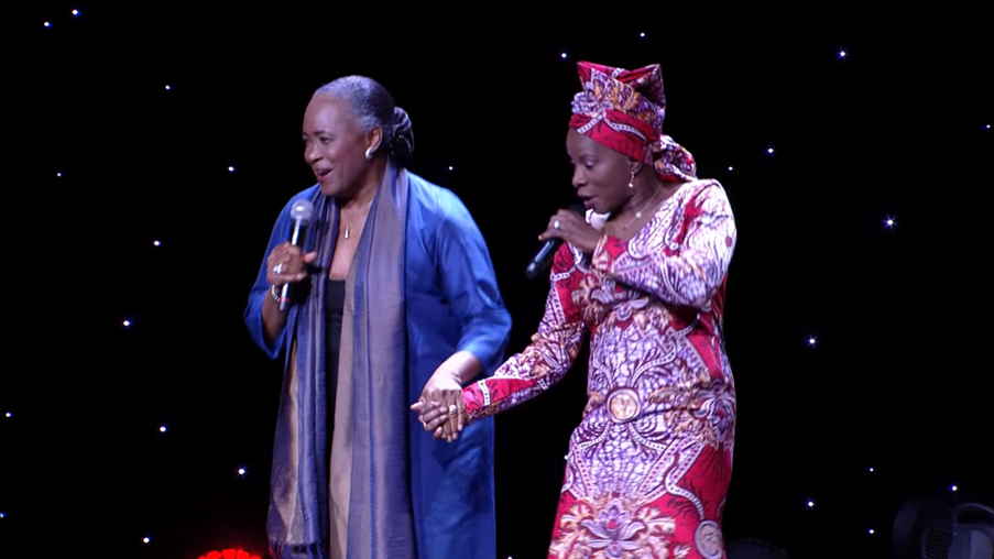 Two women dancing and holding hands