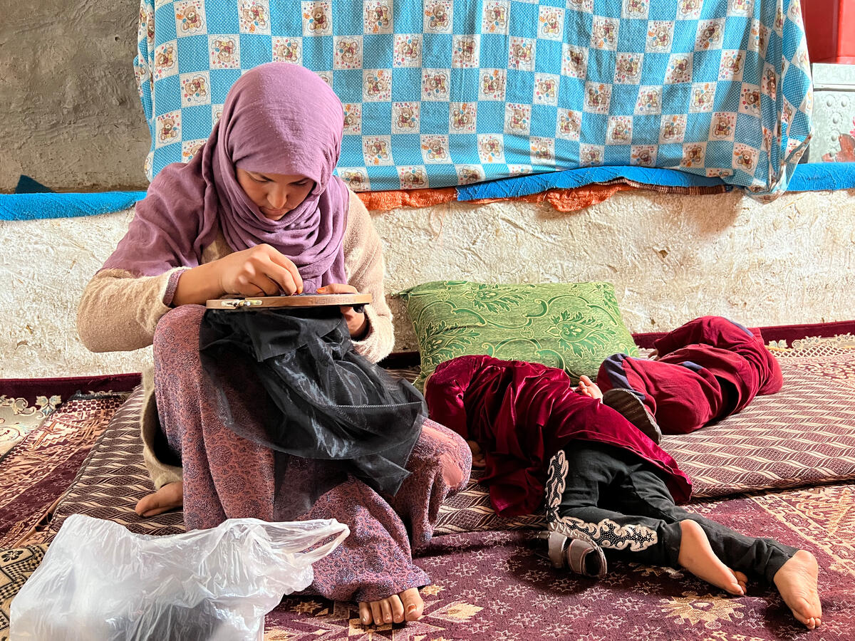 Afghanistan. Vulnerable family living in cave cliffs receive financial support from UNHCR