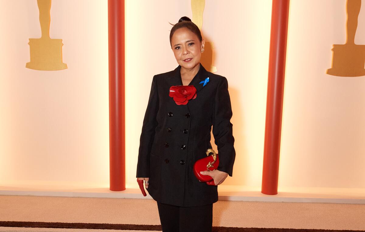 United States. Dolly De Leon arrives on the red carpet of The 95th Oscars and wears a blue ribbon in solidarity with refugees