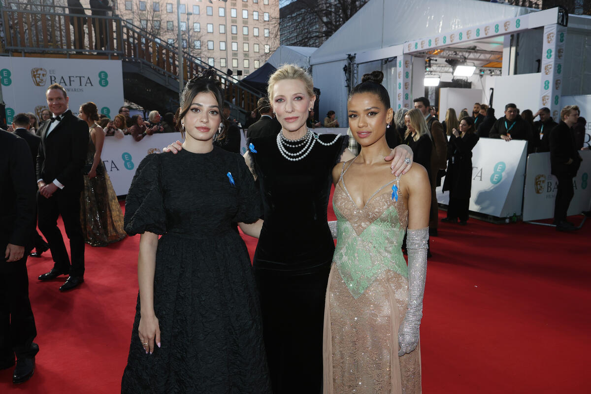 United Kingdom. UNHCR Goodwill Ambassadors Yusra Mardini, Cate Blanchett, and Gugu Mbatha-Raw wearing blue ribbons at the EE BAFTA Film Awards 2023