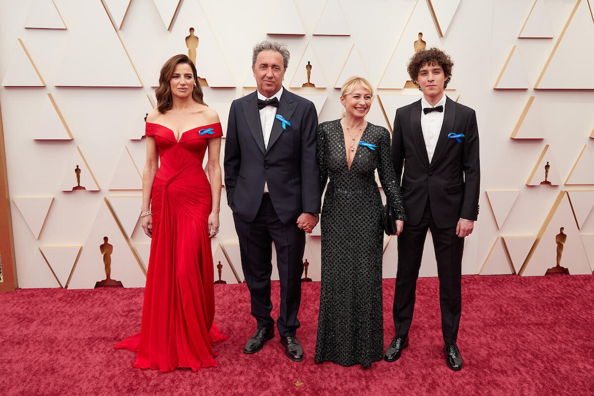 United States. 94th Oscars nominee Paolo Sorrentino arrives with guests on the red carpet wearing blue ribbons in solidarity with refugees
