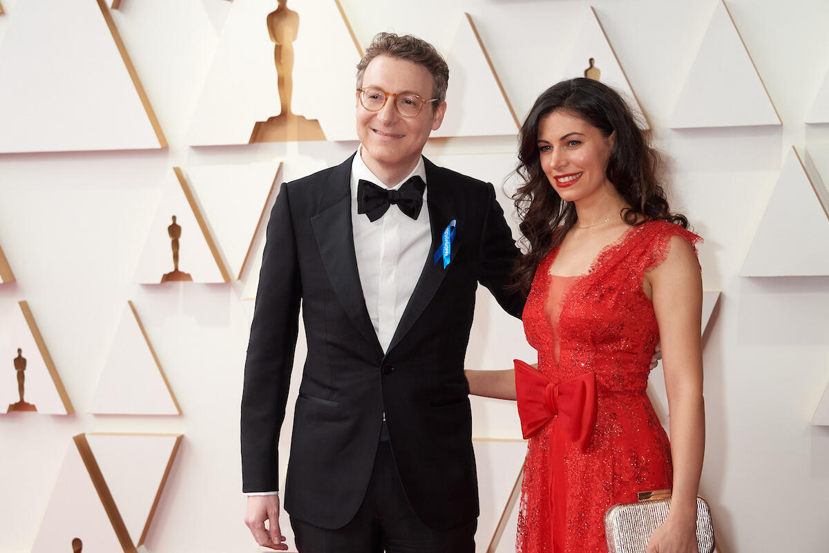United States. 94th Oscars nominee Nicholas Britell arrives with guest at the Oscar Nominee Luncheon wearing a blue ribbon in solidarity with refugees